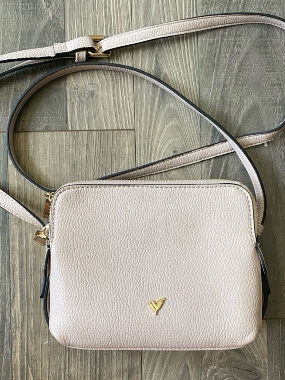 Compact Cream Pebbled Crossbody Bag with Gold Accent